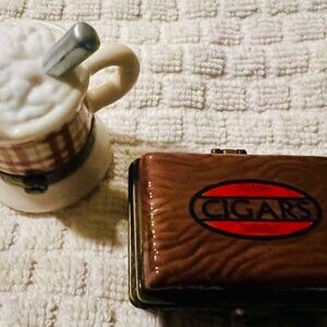Little ceramic trinket boxes.  Cigars and shaving